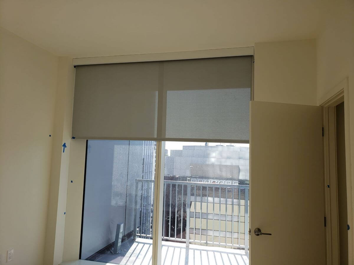 Commercial roller shades installed in Katy TX by Shutters & Blinds of The Woodlands