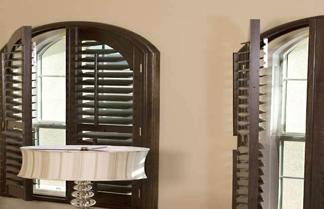 Stained wood shutters installed in Tomball TX